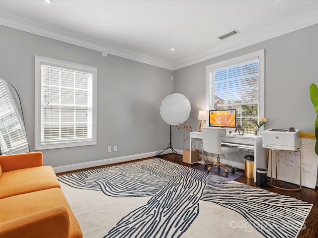 office area featuring ornamental molding, wood finished floors, visible vents, and baseboards