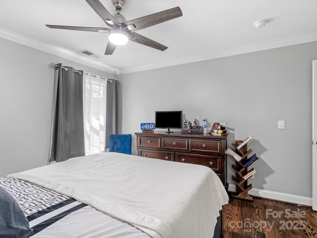 bedroom with baseboards, visible vents, ornamental molding, and wood finished floors