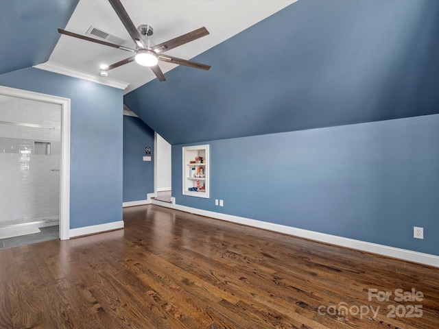 additional living space with ceiling fan, wood finished floors, visible vents, baseboards, and built in features