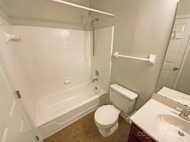 bathroom with vanity, tub / shower combination, tile patterned flooring, and toilet