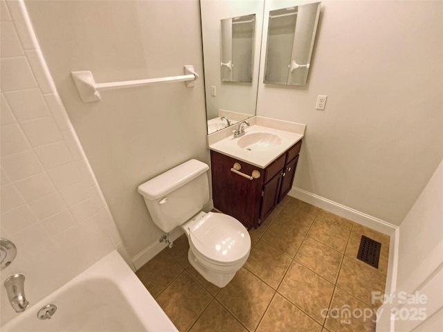 bathroom featuring toilet, vanity, baseboards, visible vents, and tile patterned floors