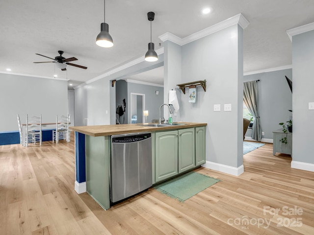 kitchen with wooden counters, green cabinetry, light wood-style flooring, a sink, and dishwasher