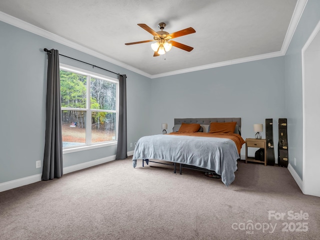 carpeted bedroom with a ceiling fan, baseboards, and ornamental molding