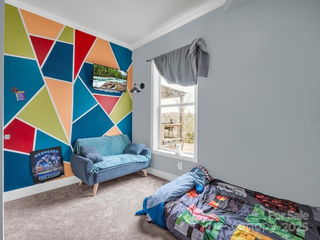 carpeted bedroom featuring baseboards and crown molding