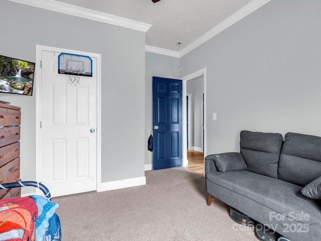 living area with baseboards, carpet, and ornamental molding