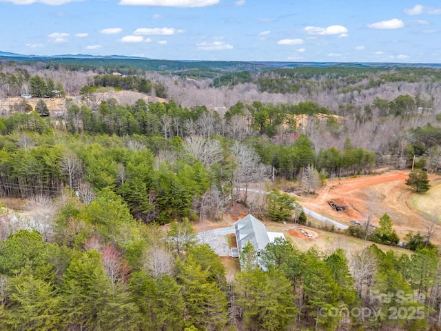 bird's eye view featuring a view of trees