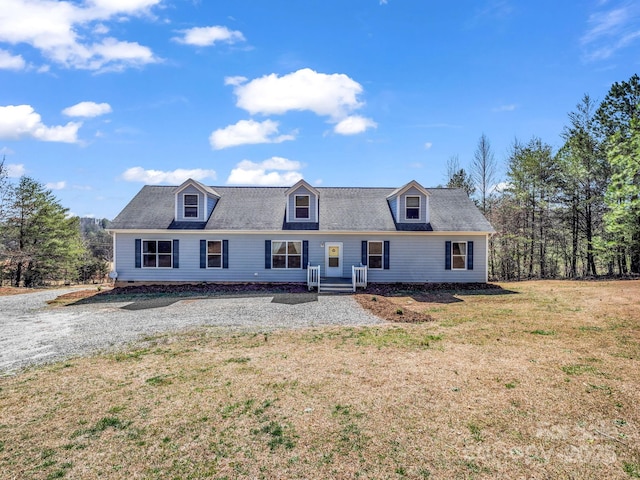 cape cod home with a front lawn and crawl space