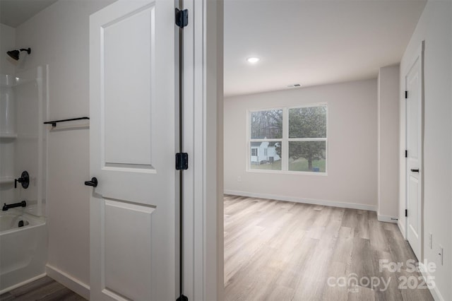 bathroom with bathtub / shower combination, recessed lighting, wood finished floors, visible vents, and baseboards