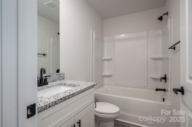 bathroom featuring visible vents, vanity, toilet, and shower / bathtub combination