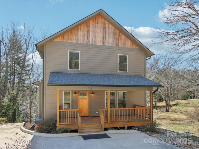 view of front of house featuring a porch and a shingled roof