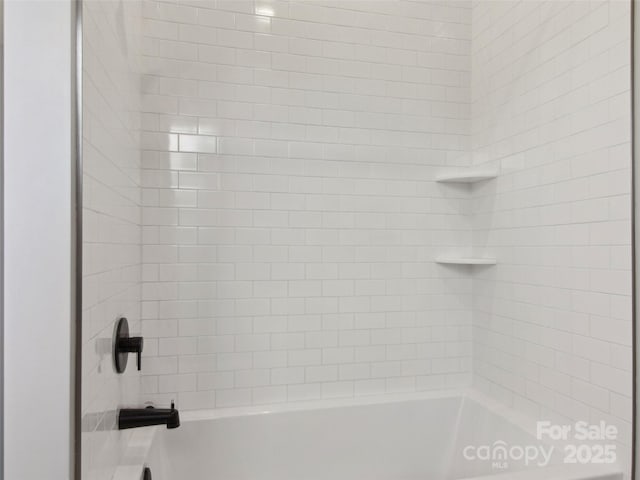 full bathroom with shower / washtub combination