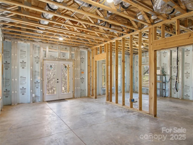 below grade area featuring french doors and plenty of natural light