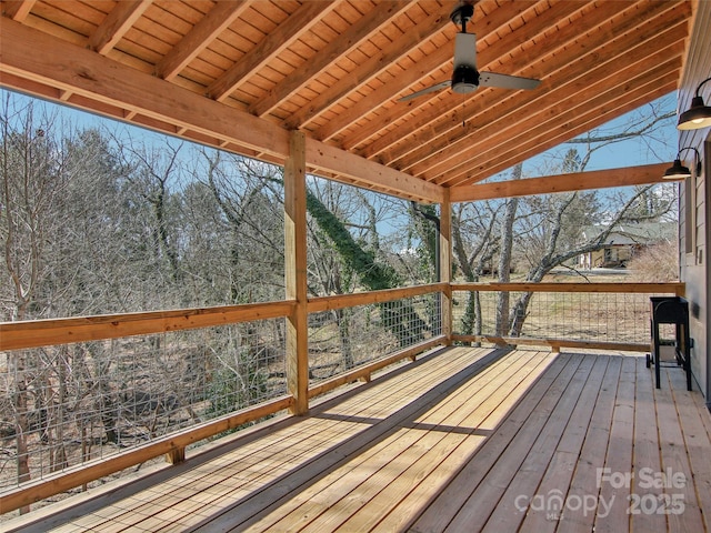 wooden deck featuring a ceiling fan