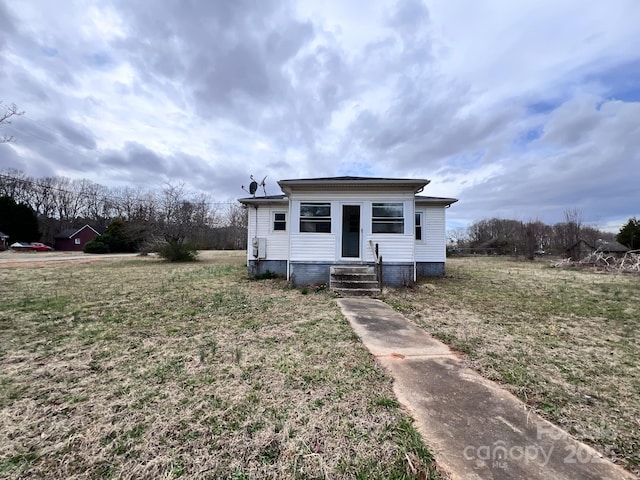 bungalow-style house with entry steps