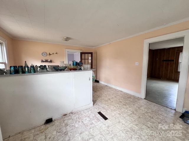 930 Weaver Rd, China Grove, NC 28023 - kitchen featuring light floors, ornamental molding, and baseboards