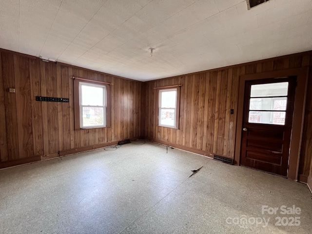 930 Weaver Rd, China Grove, NC 28023 - unfurnished room with light floors, wooden walls, and baseboards