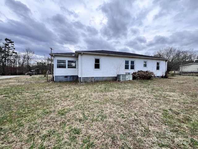 930 Weaver Rd, China Grove, NC 28023 - back of property with crawl space, a lawn, and central air condition unit