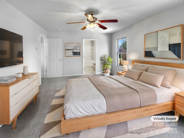 carpeted bedroom featuring ceiling fan, baseboards, and ensuite bathroom