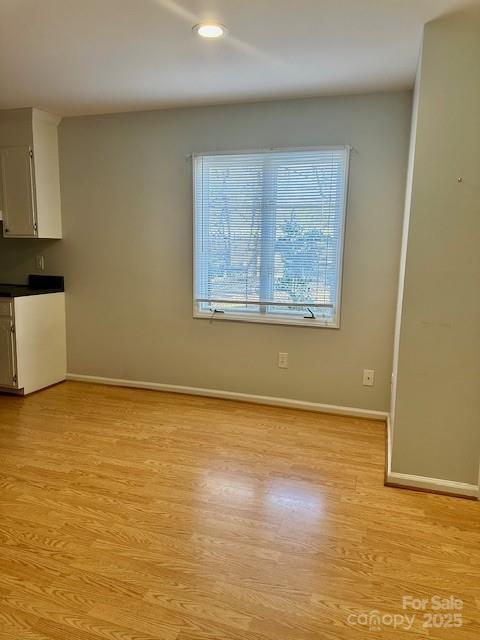 interior space with light wood-type flooring and baseboards