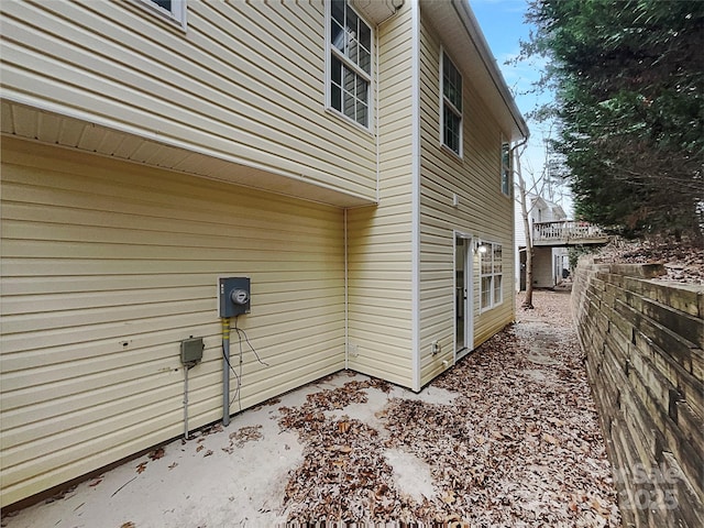 view of home's exterior featuring fence