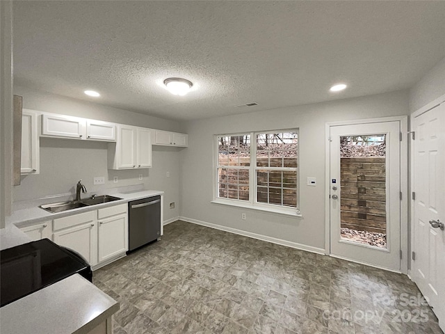 kitchen featuring a sink, white cabinetry, light countertops, and dishwasher