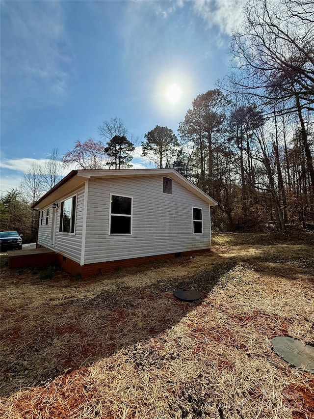 view of property exterior featuring crawl space