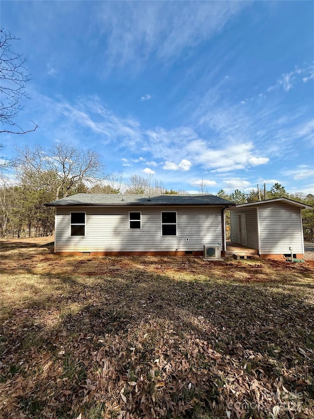 back of house with crawl space