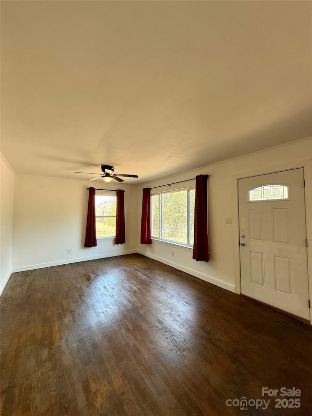 entryway with dark wood-style floors, baseboards, and a ceiling fan