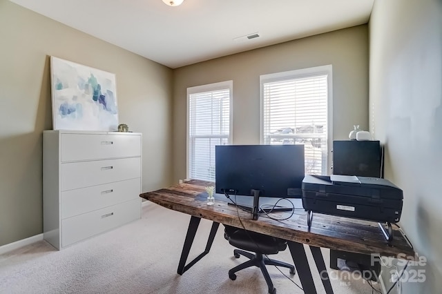 office space featuring visible vents and light colored carpet