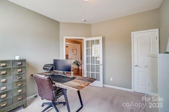 carpeted office with baseboards