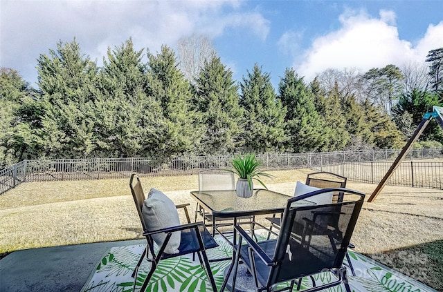 view of patio / terrace featuring outdoor dining area and a fenced backyard