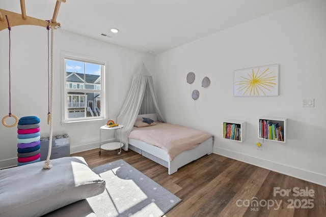 bedroom featuring recessed lighting, wood finished floors, visible vents, and baseboards