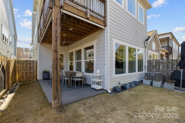 view of side of home featuring central air condition unit and a fenced backyard