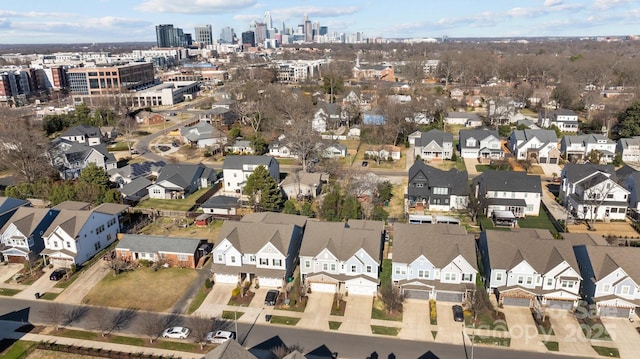 birds eye view of property with a residential view