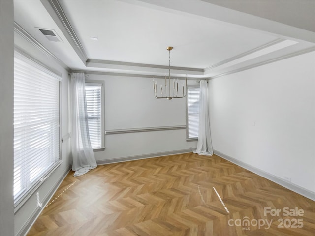 unfurnished dining area featuring a raised ceiling, visible vents, baseboards, and an inviting chandelier