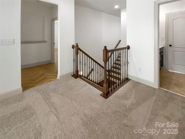 stairs with recessed lighting, carpet flooring, and baseboards