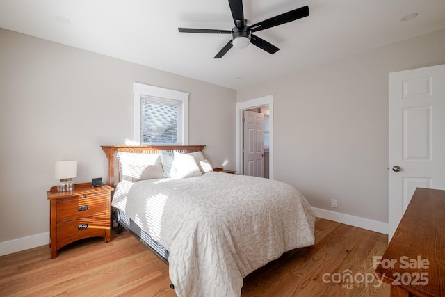bedroom featuring baseboards, ceiling fan, and light wood-type flooring