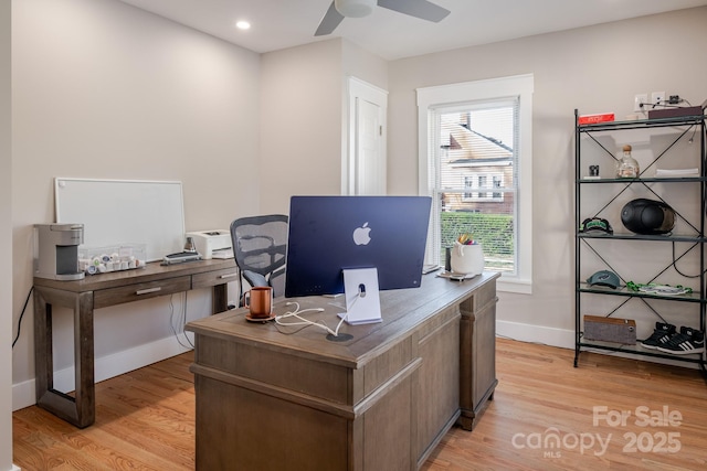 office area with a wealth of natural light, light wood finished floors, and ceiling fan