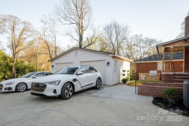 view of side of property featuring a detached garage and an outdoor structure