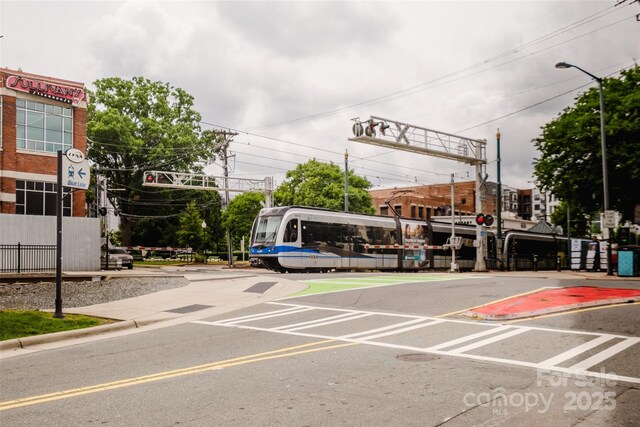 1937 Wilmore Dr, Charlotte, NC 28203 - view of asphalt street with street lighting, curbs, and traffic signs