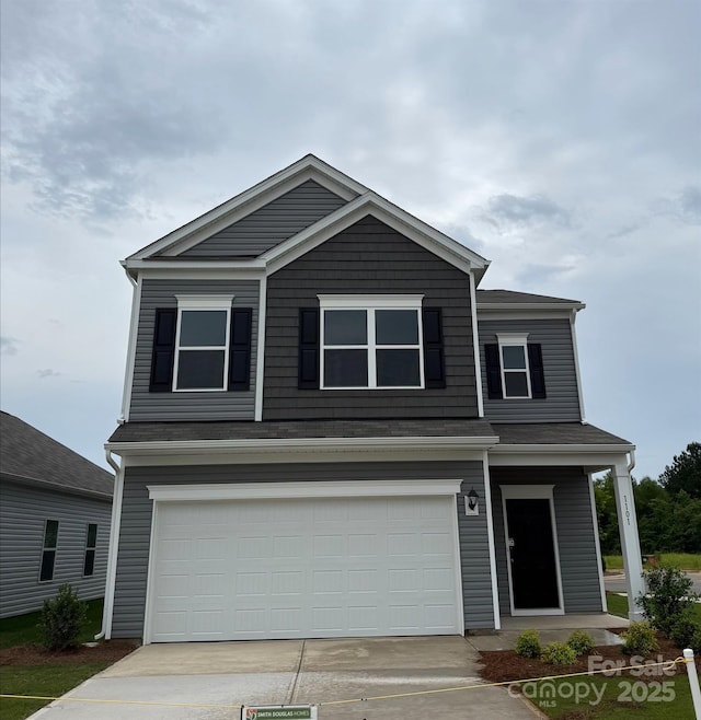 view of front of home with an attached garage and driveway