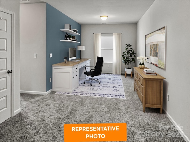home office featuring light carpet and baseboards