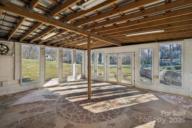 unfurnished sunroom featuring french doors