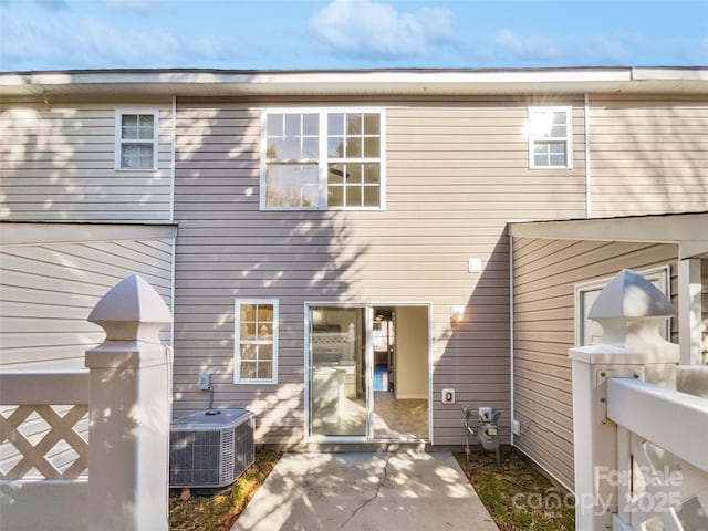 exterior space with central AC and a patio