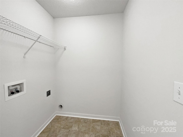 laundry area with hookup for a washing machine, laundry area, hookup for an electric dryer, and baseboards