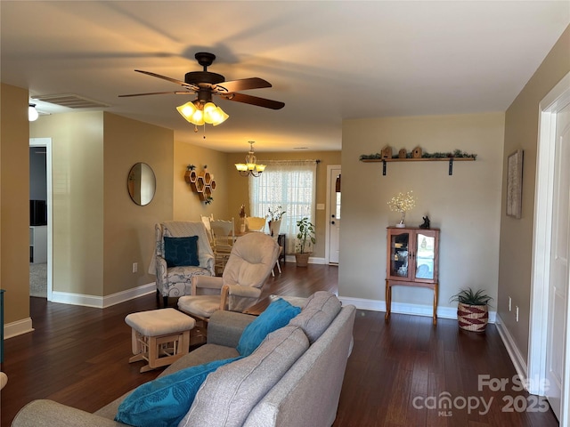 living room featuring wood finished floors, visible vents, and baseboards