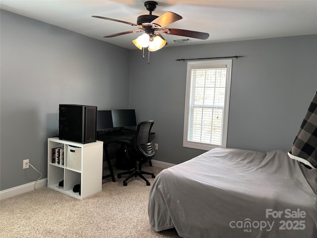 bedroom featuring light colored carpet, ceiling fan, visible vents, and baseboards