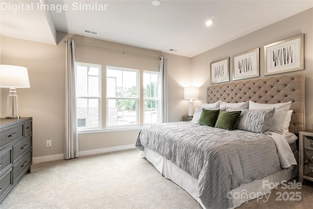 bedroom featuring light carpet, visible vents, and baseboards