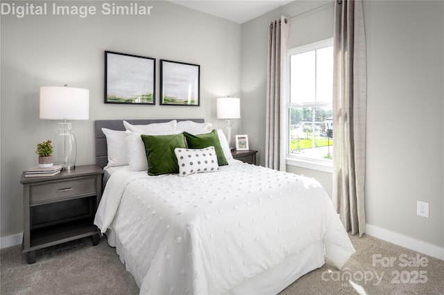 carpeted bedroom with baseboards