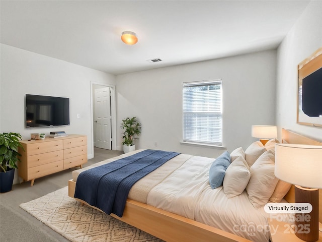 bedroom featuring visible vents and carpet flooring